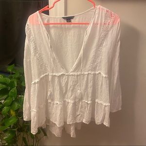 Flowy white peasant style top with eyelet detailing. Size medium